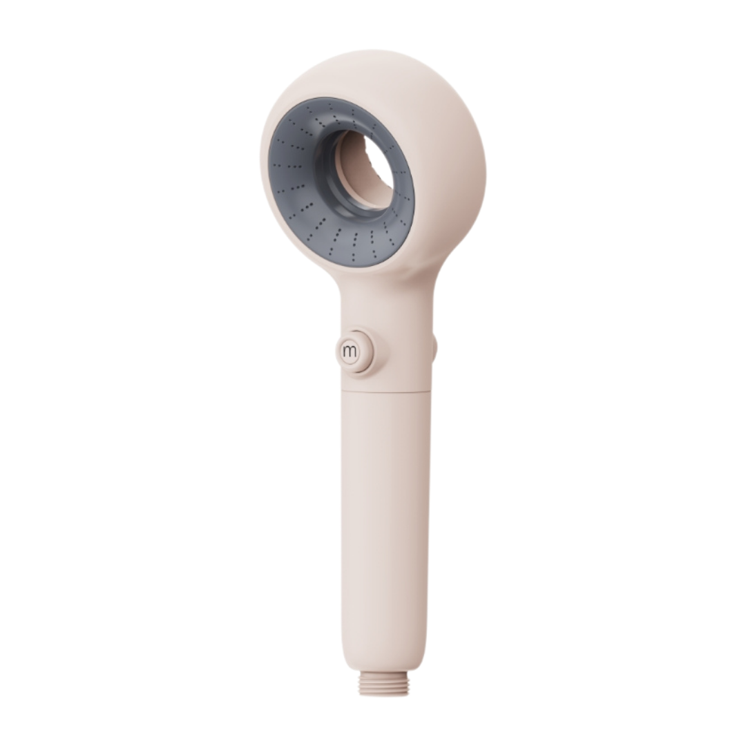 Beige handheld Murelle shower head with gray nozzle on a white background