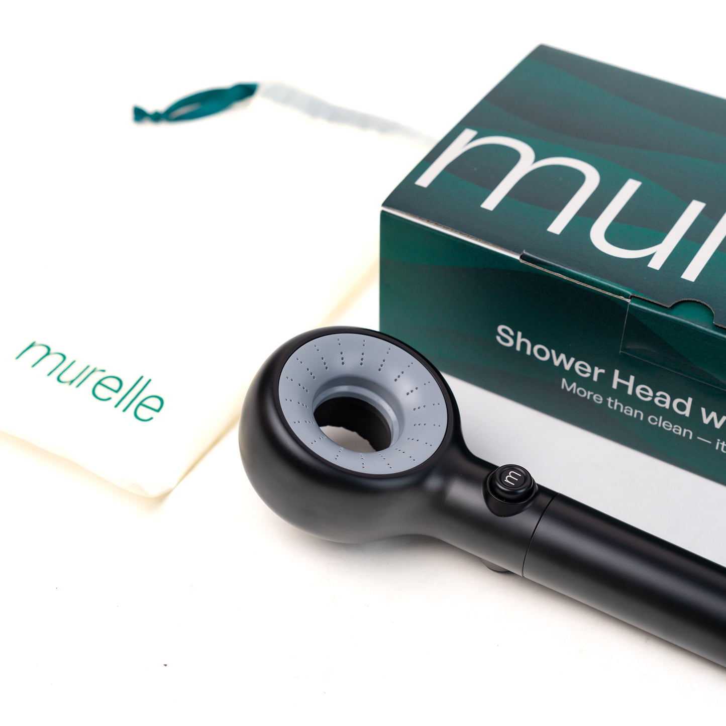 Black shower head with packaging labeled 'murelle' on a white background