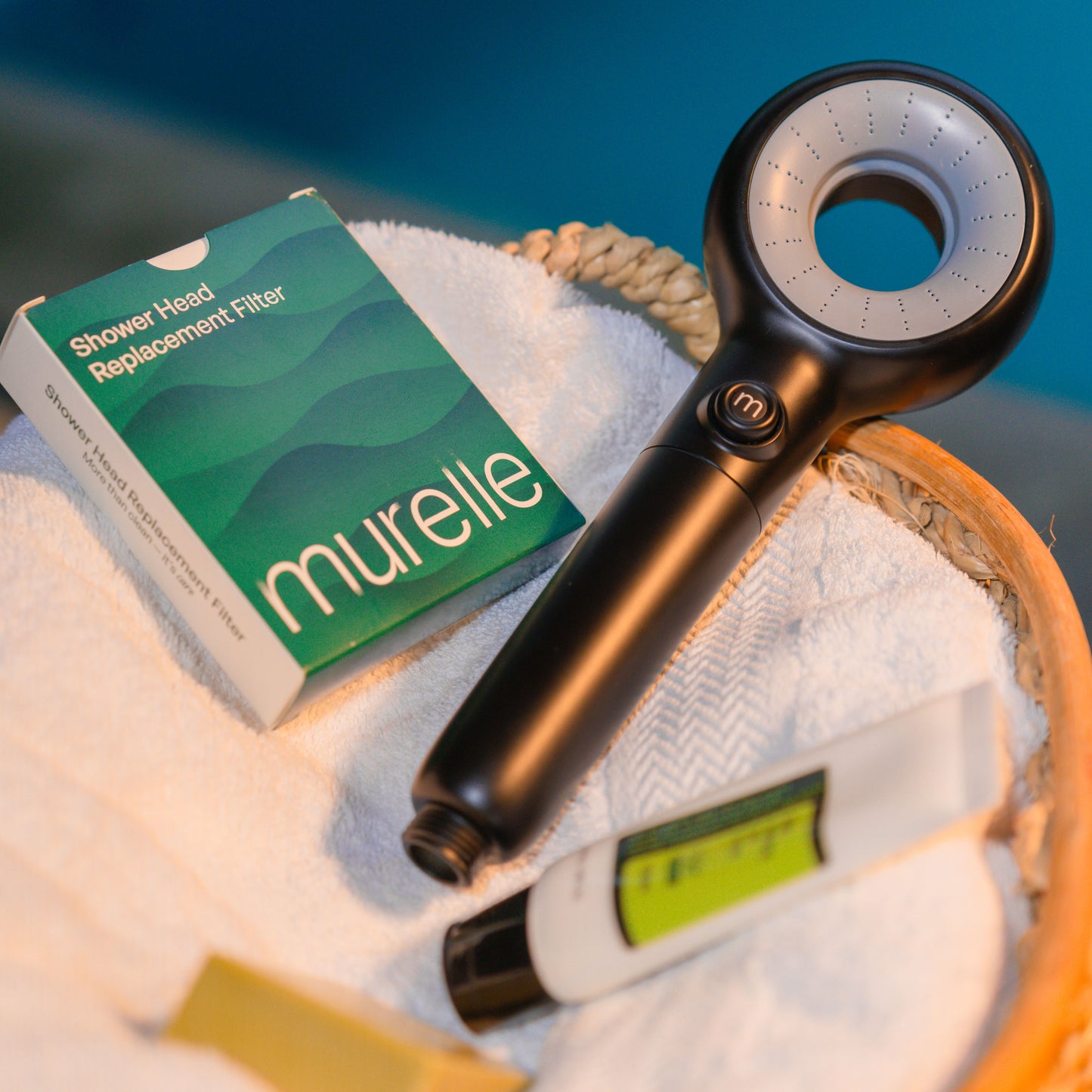 Murelle shower head replacement filter with packaging on a towel