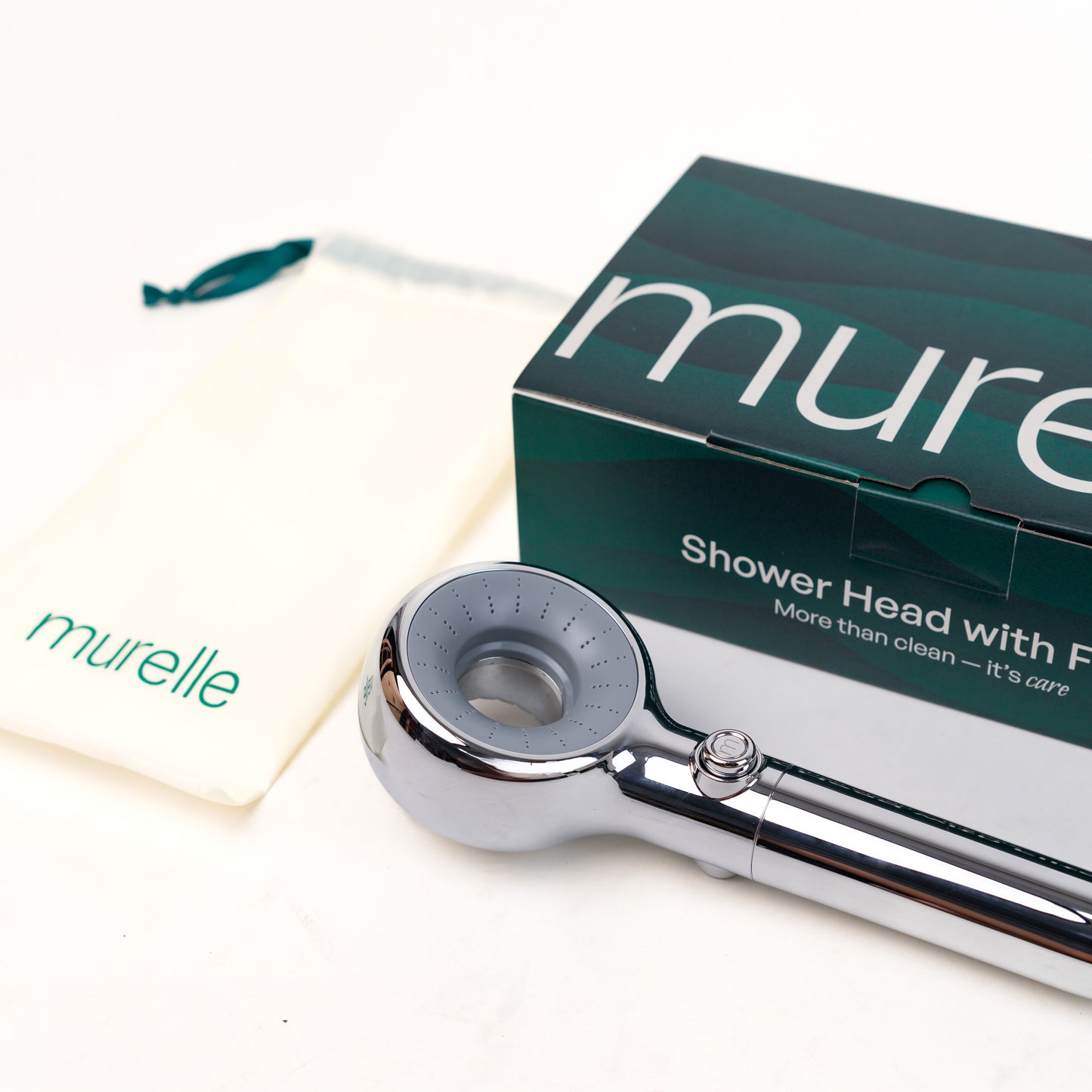 Chrome shower head with packaging displaying 'murelle' brand on a white background
