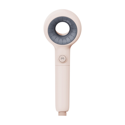 Handheld Murelle shower head with beige body and gray nozzle on a white background