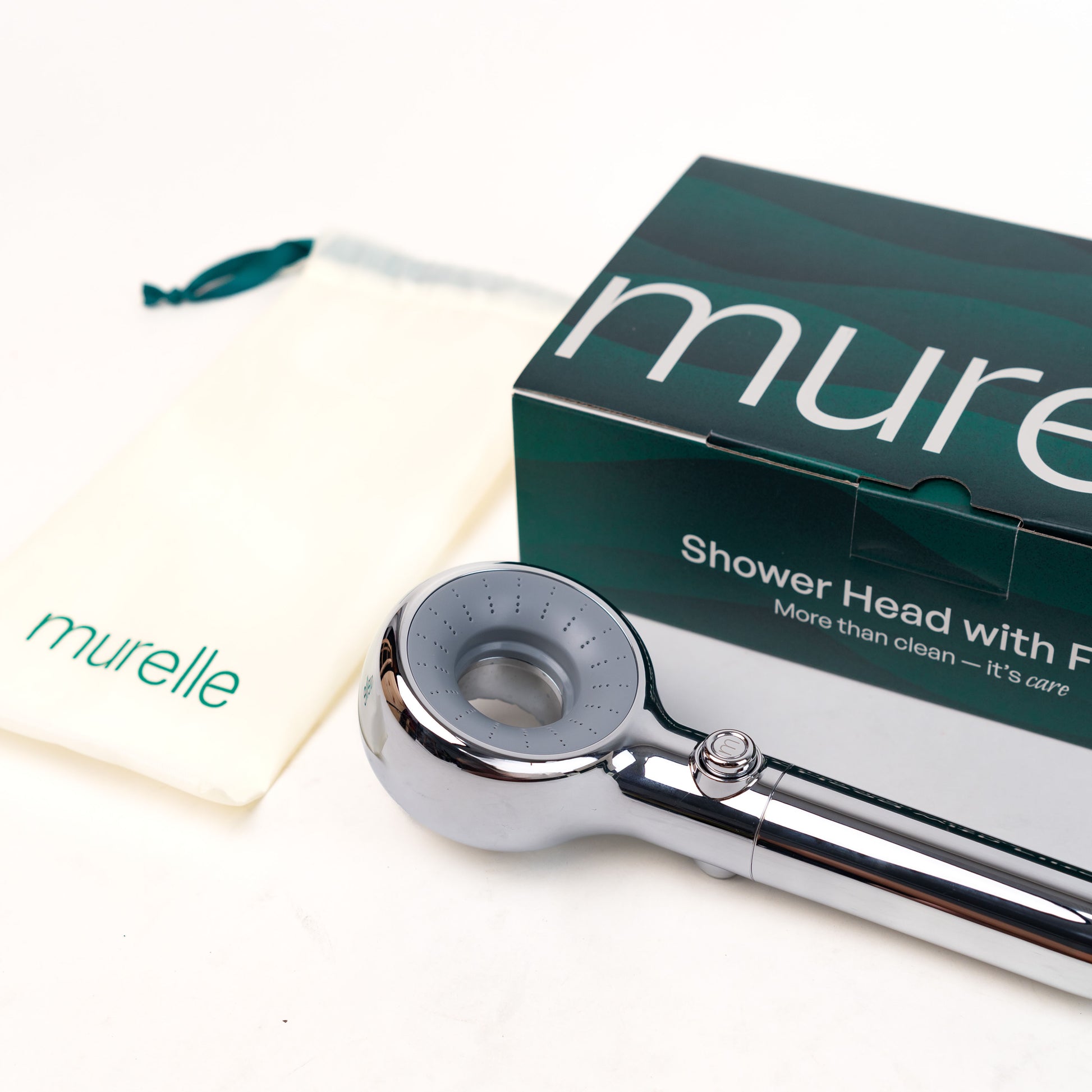 Chrome shower head with packaging displaying 'murelle' brand on a white background